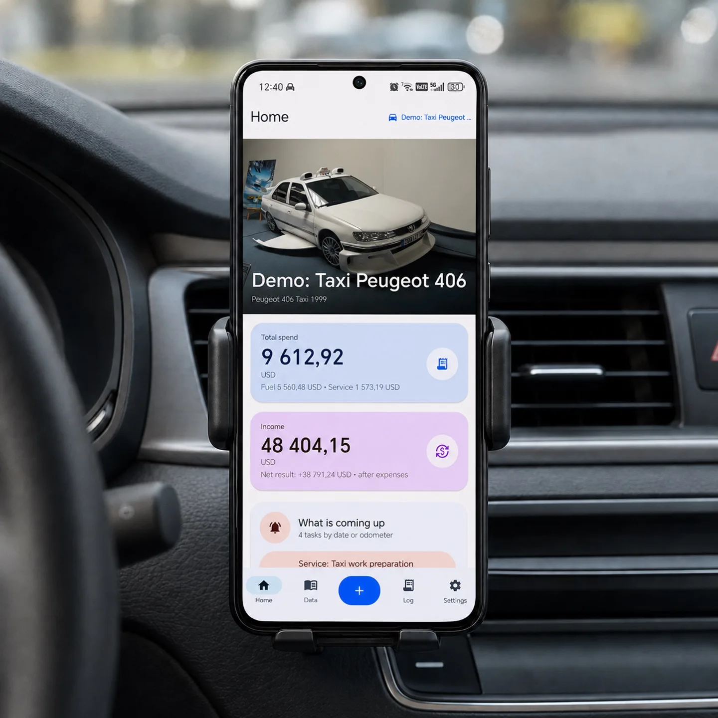 VeniCar app screen on a phone mounted inside a car
